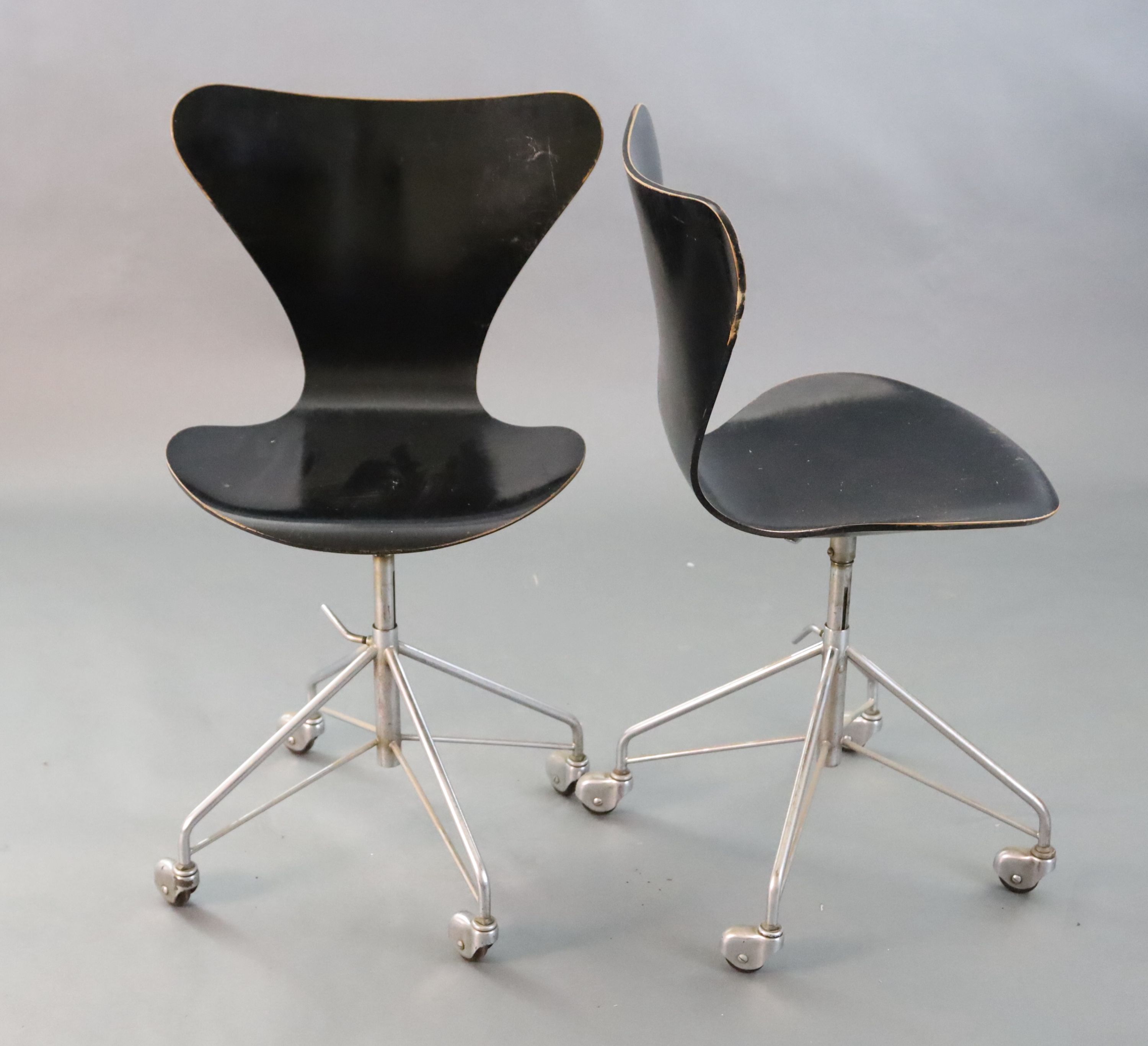 A pair of Arne Jacobsen-style Fritz Hansen 3177 ebonised bentwood revolving desk chairs, W.1ft 7in. D.1ft 7in. H.2ft 10in.